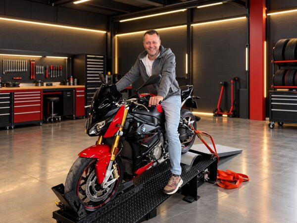 BMW motorcycle on a Dynomax MotoDyno test stand in a modern workshop